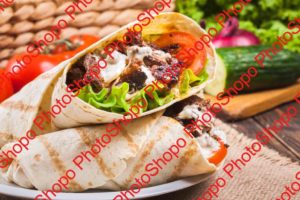 Tasty fresh wrap sandwich with beef and vegetables